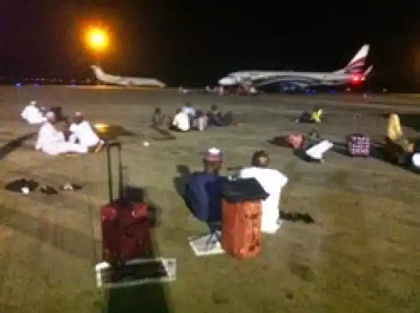 Angry passengers sit on tarmac in Abuja