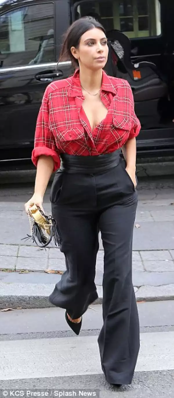 Danger In A Red Shirt: Kim Kardashian Flashes Ample Cleavage in Plaid Shirt