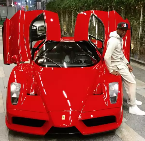 Floyd Mayweather shows off his Red Ferrari