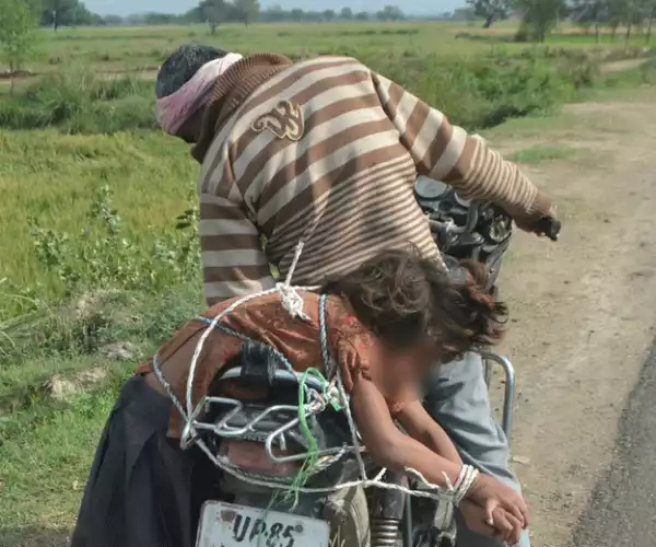 Indian Man Arrested For Forcefully Taking Daughter To School Tied On a Motorcycle