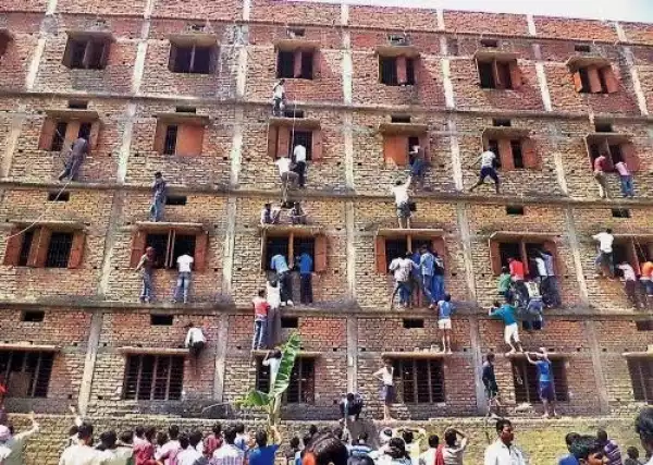 Indian students whose parents climbed a wall to help them cheat? 600 of them have been expelled