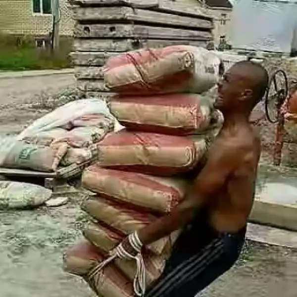 Is This Possible? See Photo Of A Man Lifting 7 Bags Of Cement
