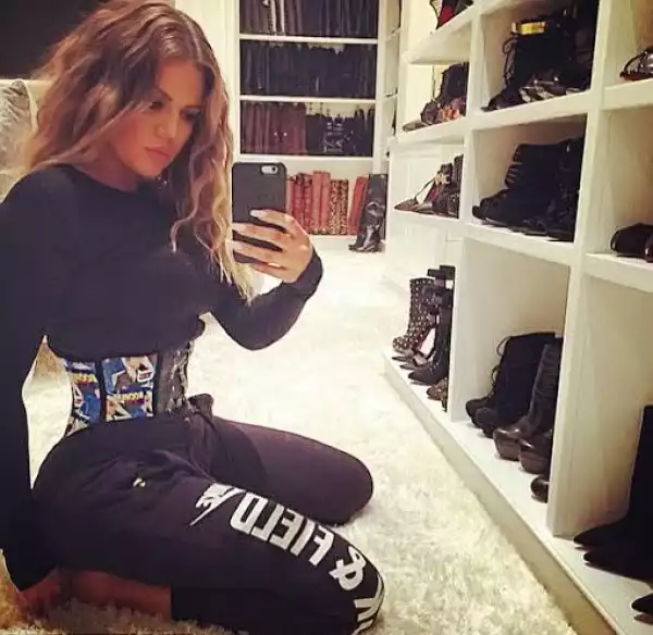 Khloe K shows off waist trainer & boots section of her closet