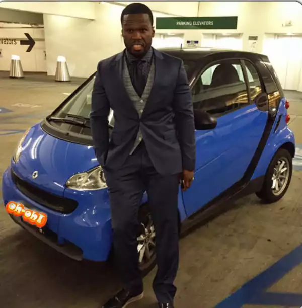 Lol. 50 Cent Poses By Small Car, Says Times Are Hard