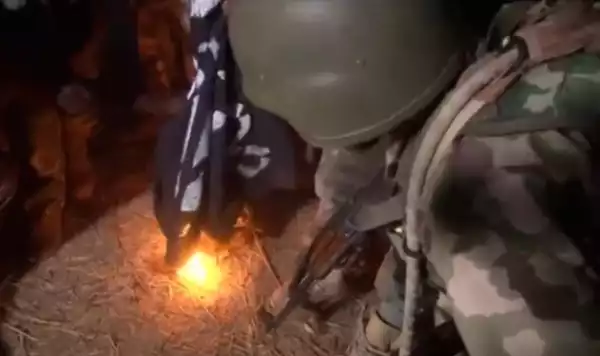 Nigerian soldiers burn Boko Haram black flags