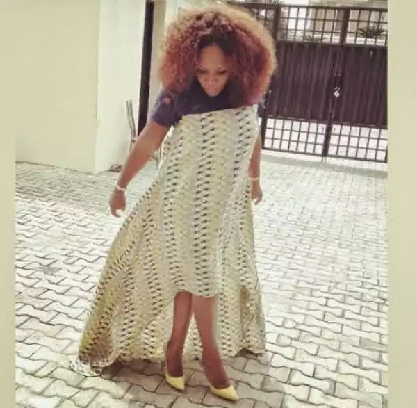 Omawumi and her growing baby bump step out