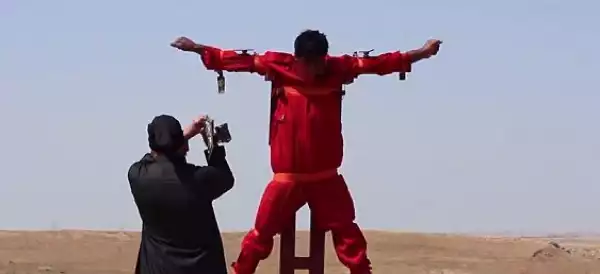 Photo: Horrific ISIS Video Shows A Man’s Hand & Foot Chopped Off While He’s Tied To A Cross 