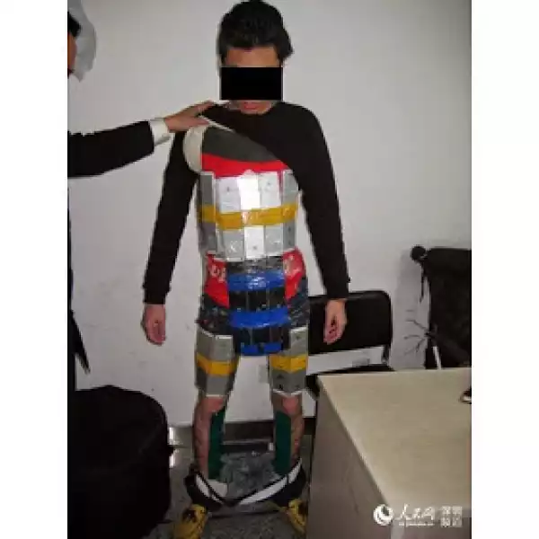 Photo: Man Caught Trying to Enter China with 94 Stolen iPhones Strapped to his Body