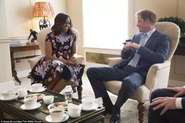 Photos: Lady Michelle Obama Meets Prince Harry At Kesington Palace 