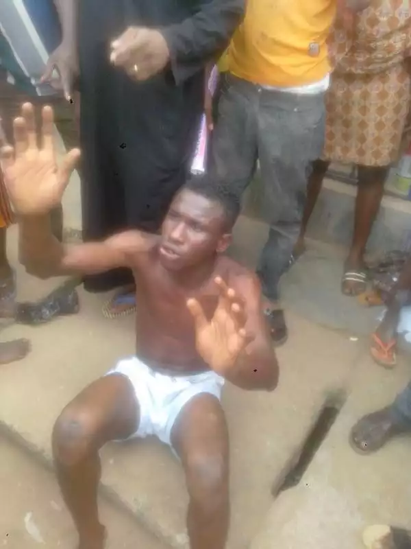 Photos: Thief Caught Broad Daylight Trying To Rob A Shop Owner In Lagos, Stripped