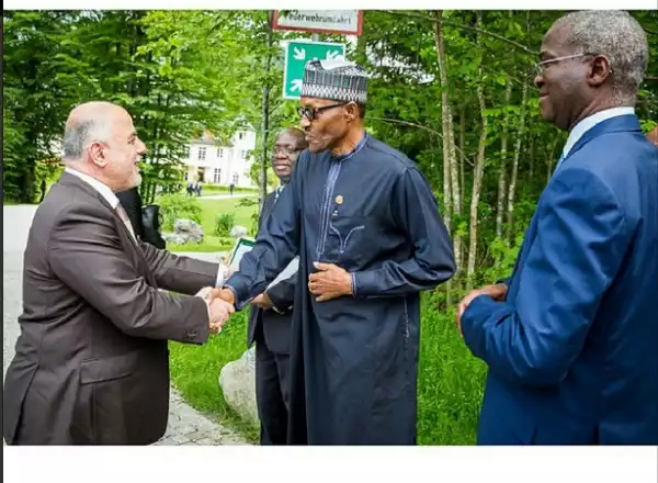 Photos Of Buhari And Fashola Strolling On The Streets Of Germany