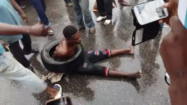 Photos Of Mob On Allen Avenue Lagos About To Burn A Car Thief Caught In The Act