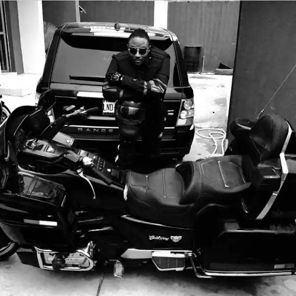Terry G Poses With His Power Bike and Range Rover