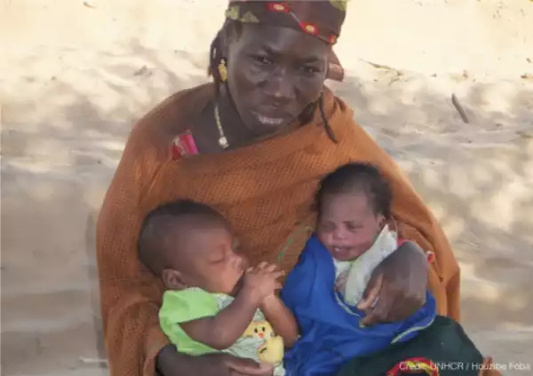 Woman rescues baby lying next to his dead mother as she fled Baga