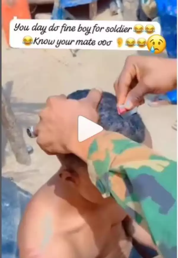Soldier Uses Razor to Shave Civilian