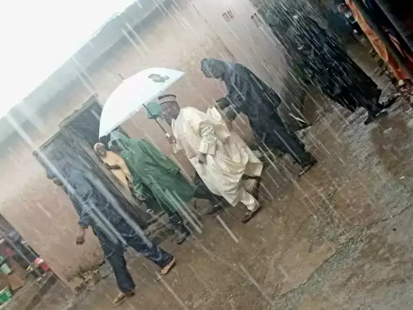 Governor Bala Mohammed Holding His Umbrella Under Heavy Downpour