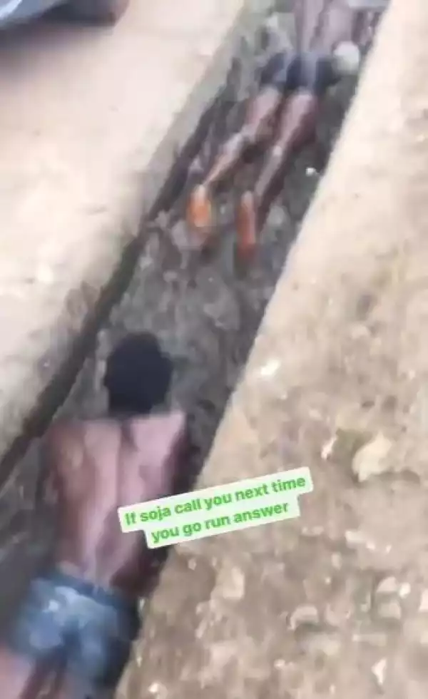 This is Wrong - Nigerians Complain As Soldier Orders Two Men to Swim in Dirty Water (Video)