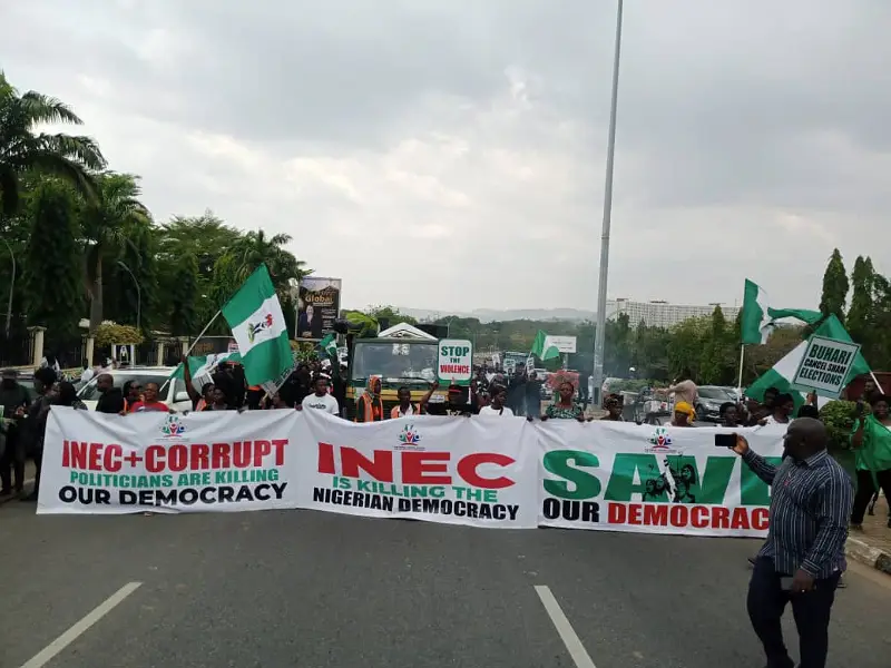 INEC-chairman-must-go protesters defy afternoon rains, storm Appeal Court