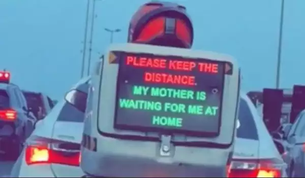 My Mother Is Waiting For Me At Home – Dispatch Rider Uses Display Sign To Beg Lagos Drivers To Drive Carefully
