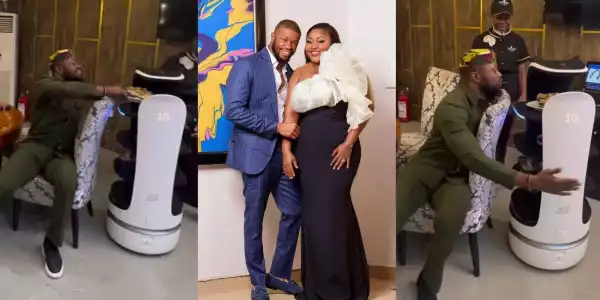 Actor Stan Nze set to pepper wife, Blessing Obasi as robot serves him food at a restaurant (Video)