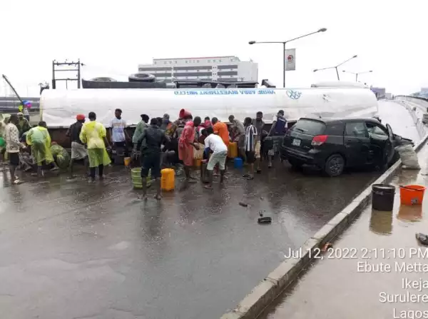 Tanker Falls At Costain, Crushing Car And Spilling Its Content On The Road (Video)