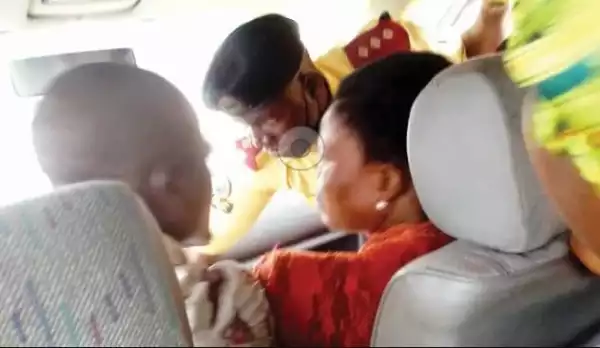 Passengers Panic As LASTMA Officer, Driver Scuffle In Motion