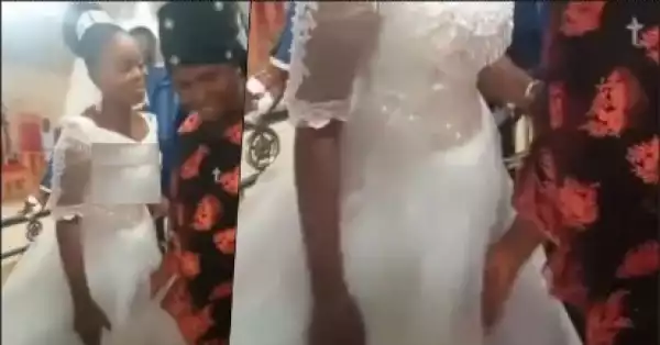 “Na juju” — Reactions as wedding guest touches bride suspiciously (Video)