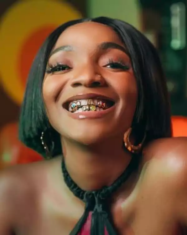 Singer Simi Flaunts Her Teeth Grills