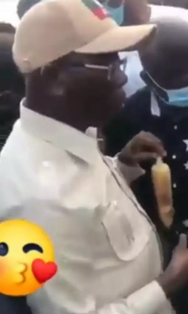 Oshiomhole Buys Roasted Corn By The Roadside, Eats It In Public As People Hail Him (Video)