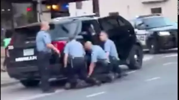 New video shows three Minneapolis officers kneeling on George Floyd before he died