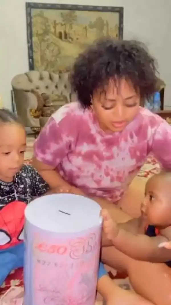 Regina Daniels Shows Off Wads Of New Notes Her Sons Are Saving In Their Piggy Bank (Video)