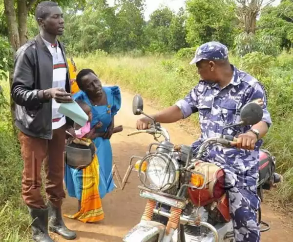COVID-19 Lockdown: Woman kneels down begging police officers not to confiscate motorcycle of a rider carrying her and sick child to hospital (photos)