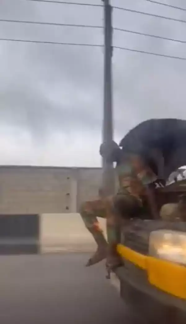 Man Spotted Catching A Ride In The Engine of A Speeding Car In Lagos (Video)