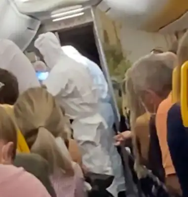 Passenger infected with COVID-19 is pulled off Ryanair flight by hazmat-clad officials (video)