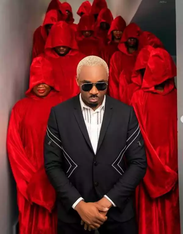 Pretty Mike Storms Party With Men Draped In Red Attire Carrying Another Man Who Is Almost N*ked (Photos/Videos)