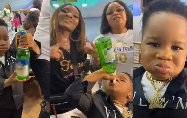 ”This Is Failed Parenting” – Nigerians React To Video Of A Little Boy Taking Alcohol From A Beer Bottle