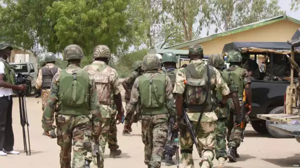 Nigerian Soldier Handled Police Officer Who Forcefully Collected 50k From Young Men (Video)