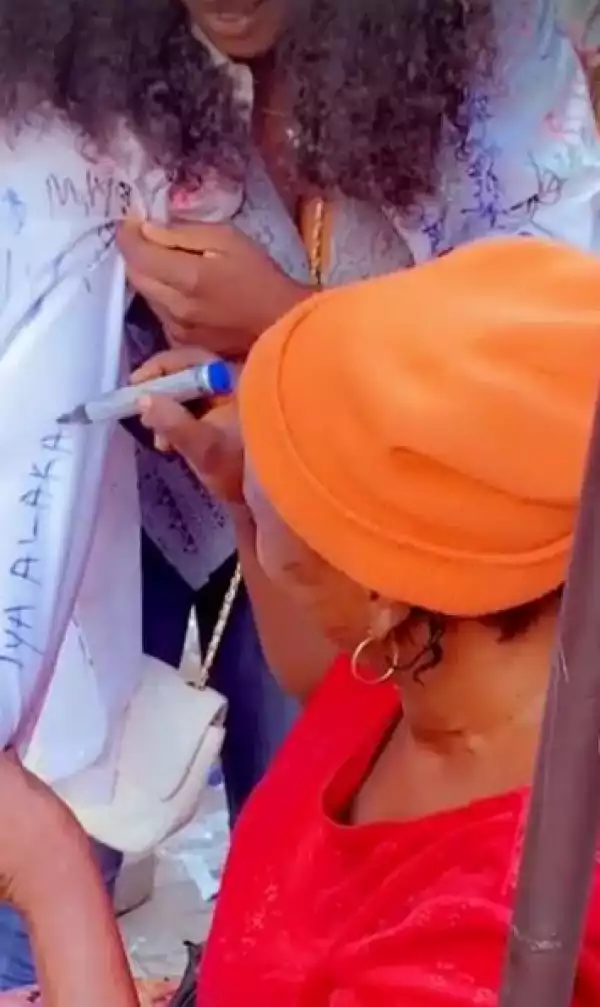 The Adorable Moment An Akara Seller Signed On Daughter’s Shirt As She Graduates From University (Video)