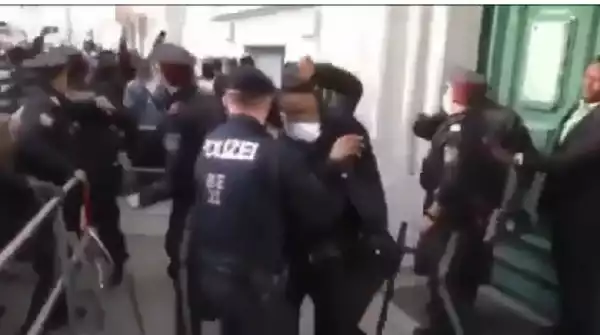 Police scramble to safeguard the Nigerian envoy to Austria as angry Nigerians attack him (video)